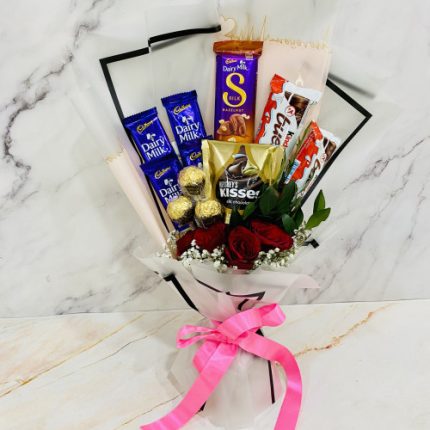 Chocolate Sky Bouquet - 5 Red Roses, 4 Cadbury Dairy Milk, Dairy Milk Silk Hazelnut, 2 Kinder Bueno, Harshey's Kisses Milk Chocolate, Ferrero Rocher 3 pcs Bouquet and Card SKU 784